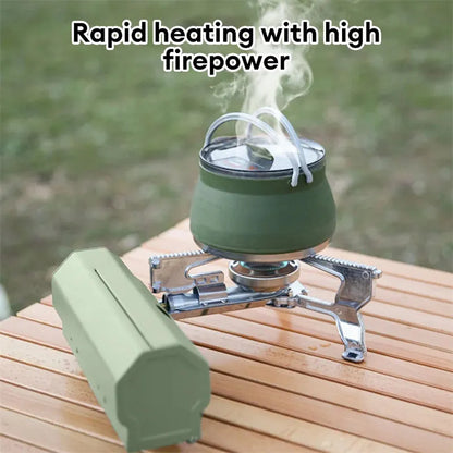 Green folding camping gas stove with serrated pot bracket, showing 25cm size next to butane canister