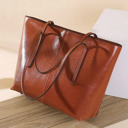 Genuine leather women's shoulder bag in retro style with multiple internal compartments and slit outer pocket