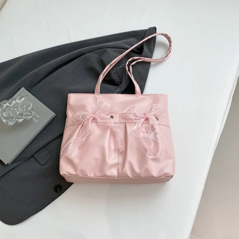 College style bow tote bag in black PU leather with double shoulder straps and bow detailing