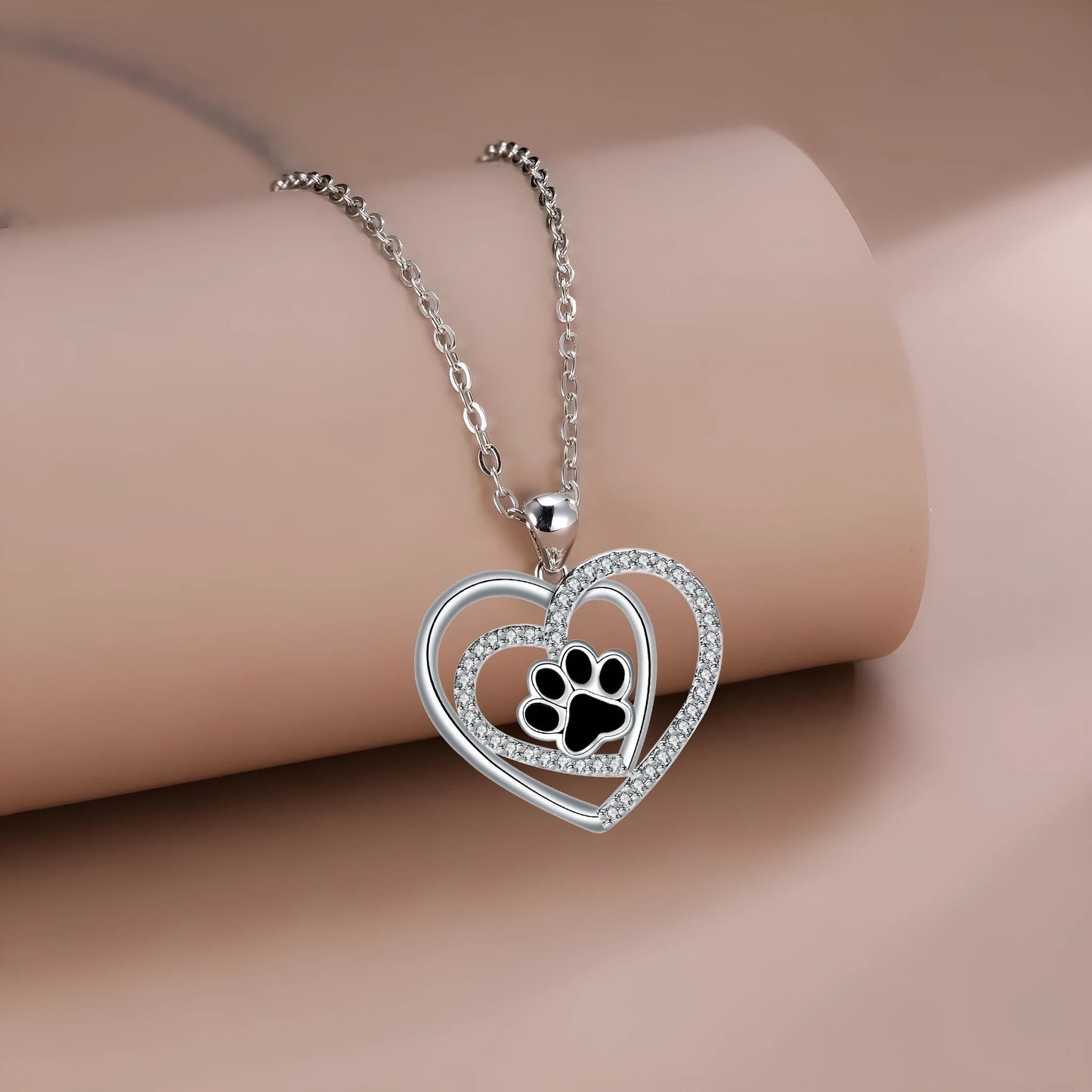 Women's dog paw print necklace with heart-shaped copper pendant on cross chain