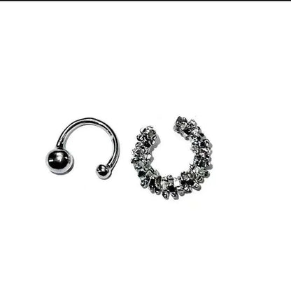 A pair of frosty-finish geometric clip-on earrings with an irregular abstract shape.