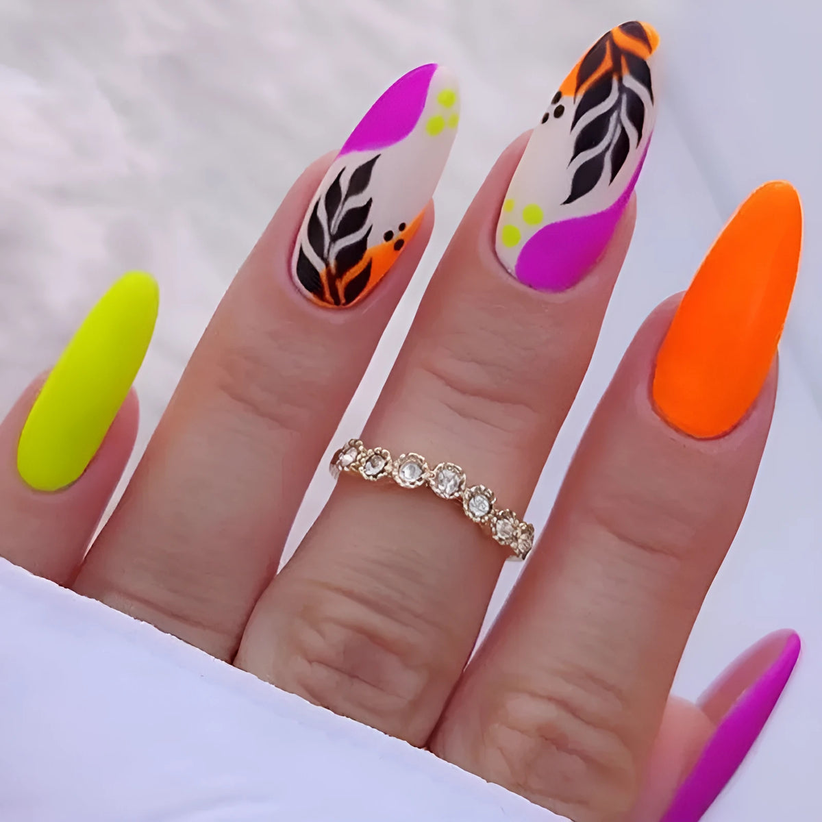 Wear Armour medium almond frosted nail stickers showing four designer patterns including French leaves and leopard print
