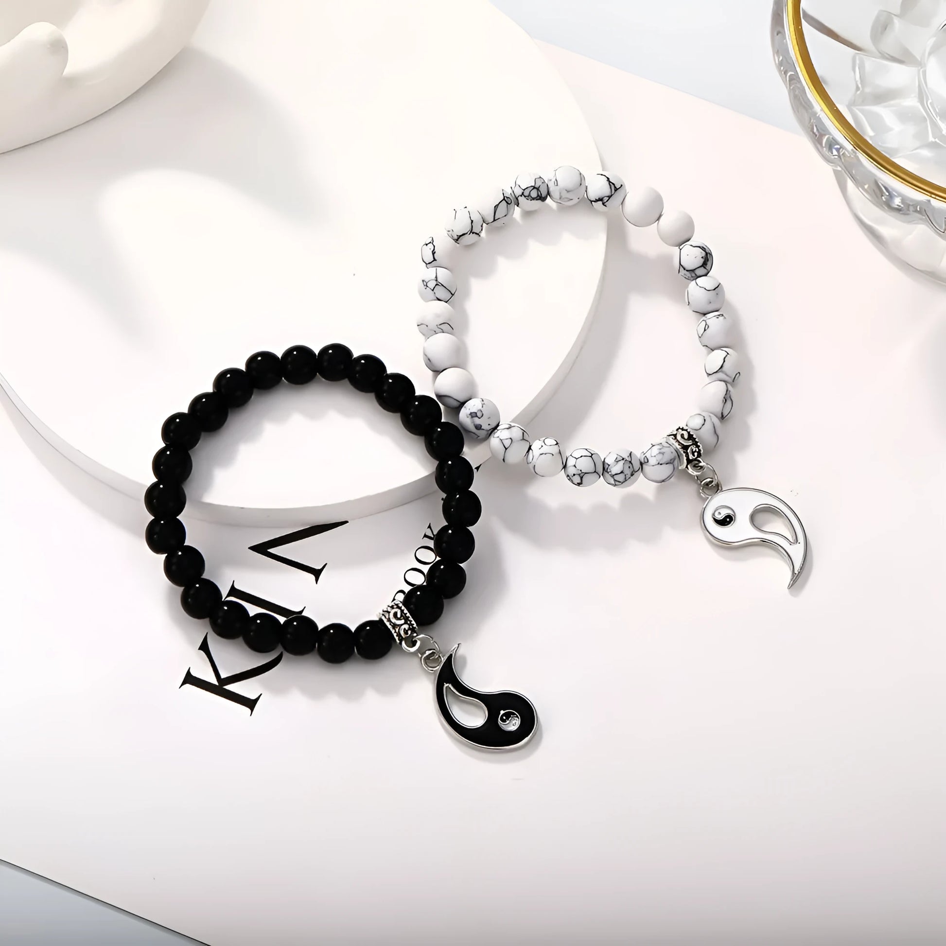 Geometric eight-diagram shaped alloy bracelet with an electroplated finish in a unisex design.