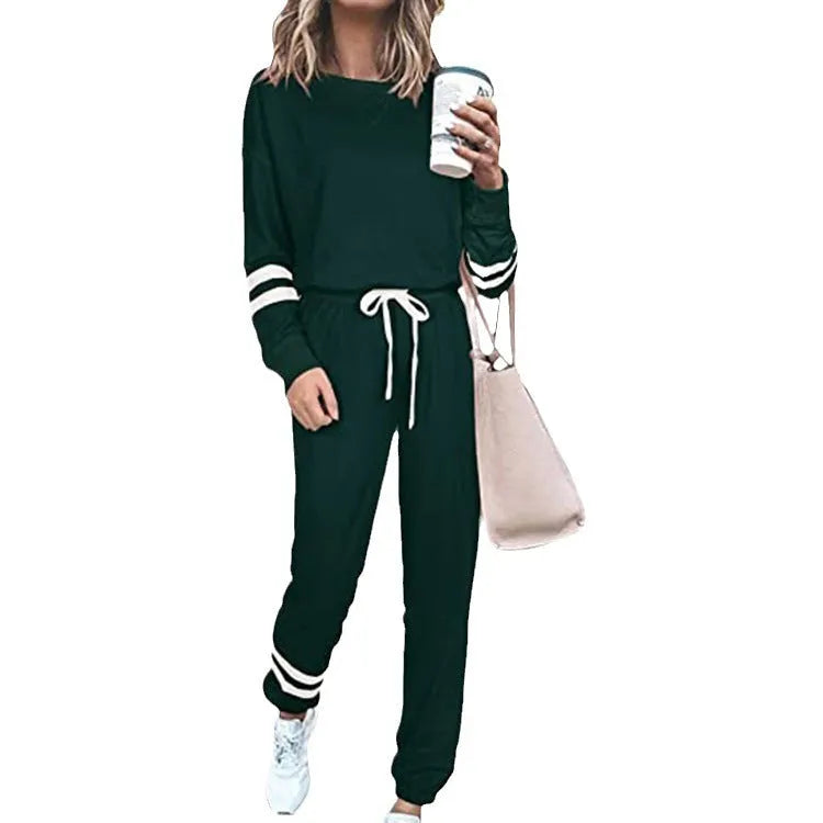Women's loose-fitting plus size casual suit in a cotton blend, shown in a solid colour with a half-sleeve top and trousers.