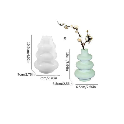 Silicone baking mould in shape of three-layer irregular circle vase on white background