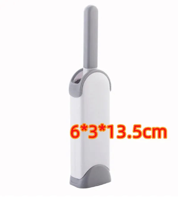 Blue reusable pet hair removal brush with double-sided head next to its self-cleaning base.