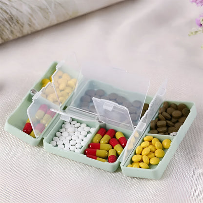 Blue foldable pill box with seven compartments and magnetic closure showing open and closed positions