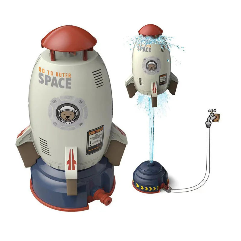 Yellow outdoor water pressure rocket launcher toy for kids on a green lawn.