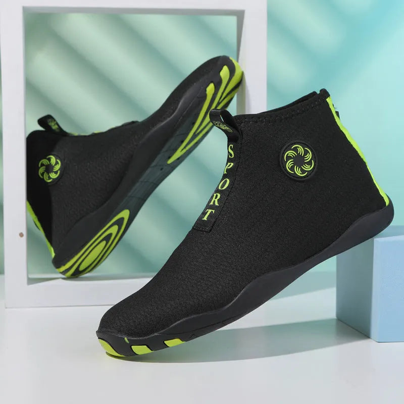 Mid-top outdoor beach shoes in black and fluorescent green with mesh upper and rubber sole.