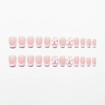 Fashion short white French cute bow manicure set with 24 nail art pieces including tulip, bow, starry sky, leopard print, and XINGX designs.