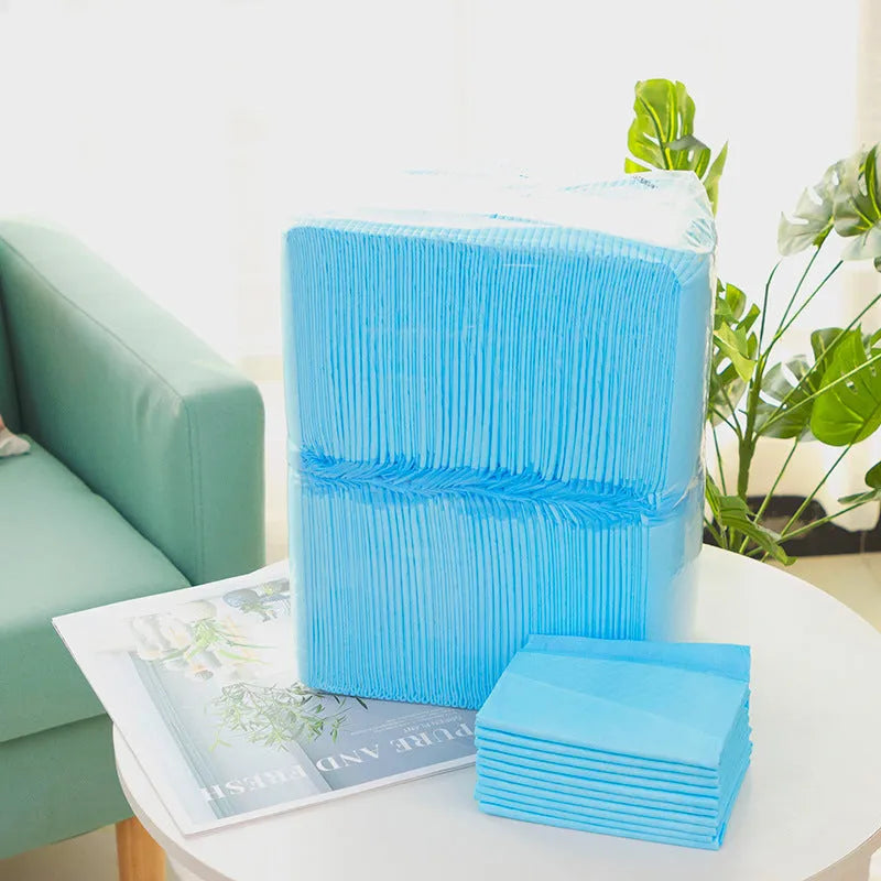 Pack of disposable pet urinal pads showing layered construction and size options S, M, L, XL for dogs and cats.