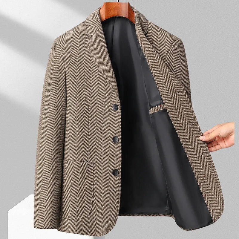 Man wearing a simple, loose-fit solid-colour casual coat in a neutral shade.