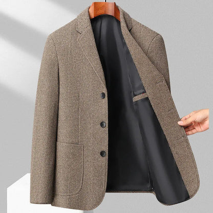 Man wearing a simple, loose-fit solid-colour casual coat in a neutral shade.