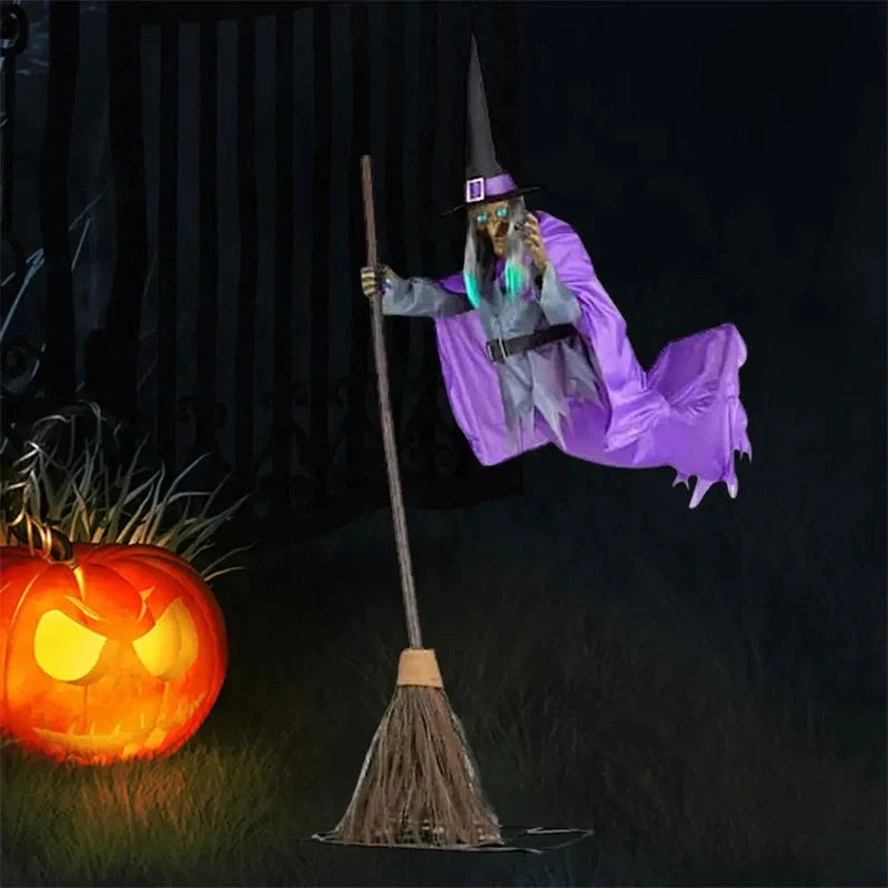 Floating witch Halloween decoration with broom, lifelike scary face, and purple hovering skirt