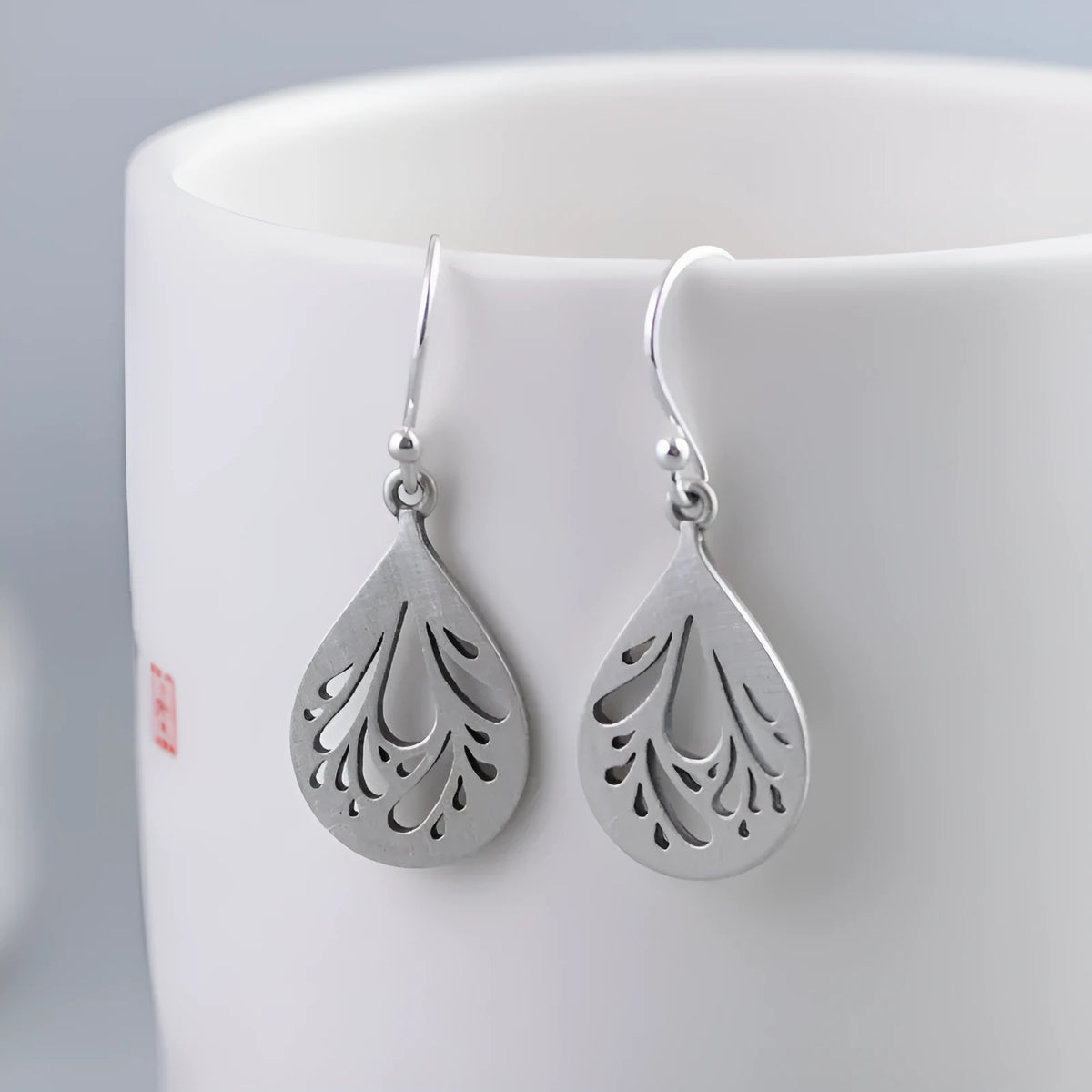 Women's retro hollow water drop silver earrings with small exquisite drop shape design