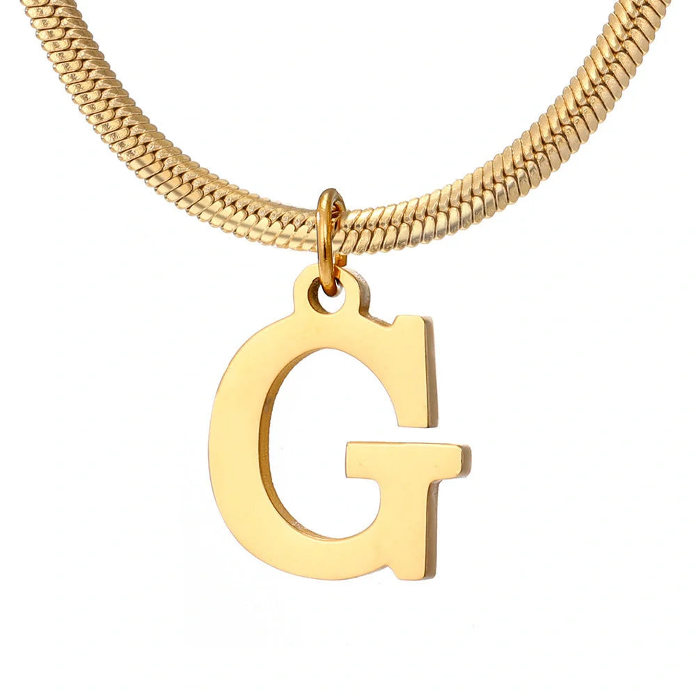 Elegant gold A-Z letter pendant necklace on a snake chain