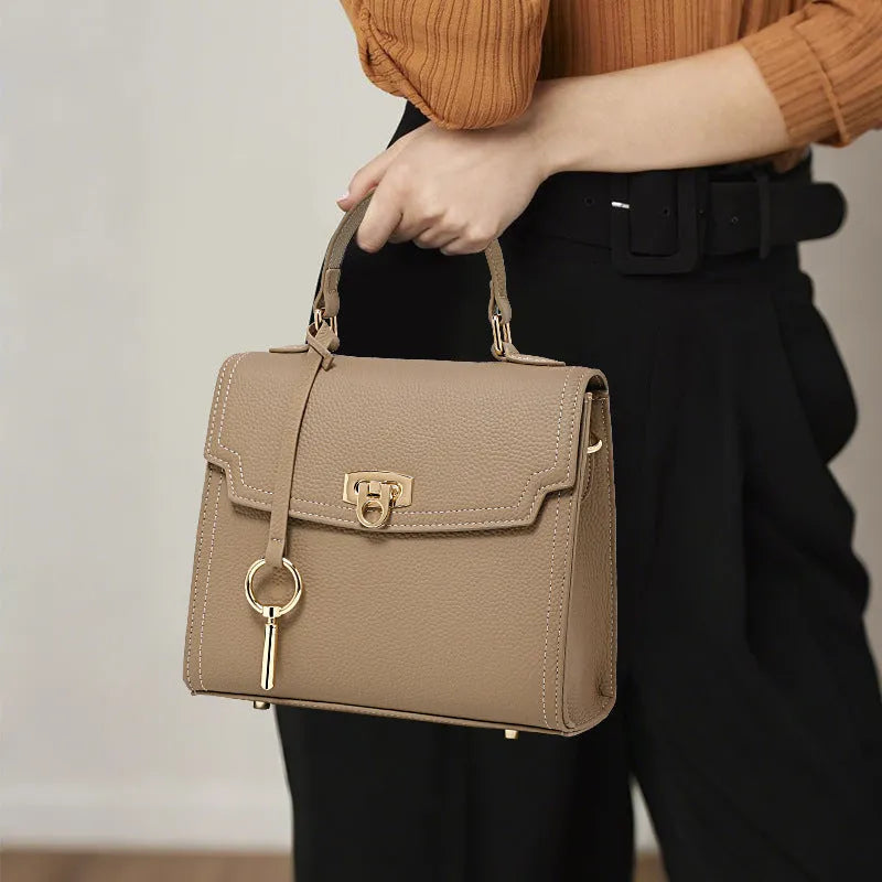 Elephant grey vintage handbag with lock detail and file organisation inside