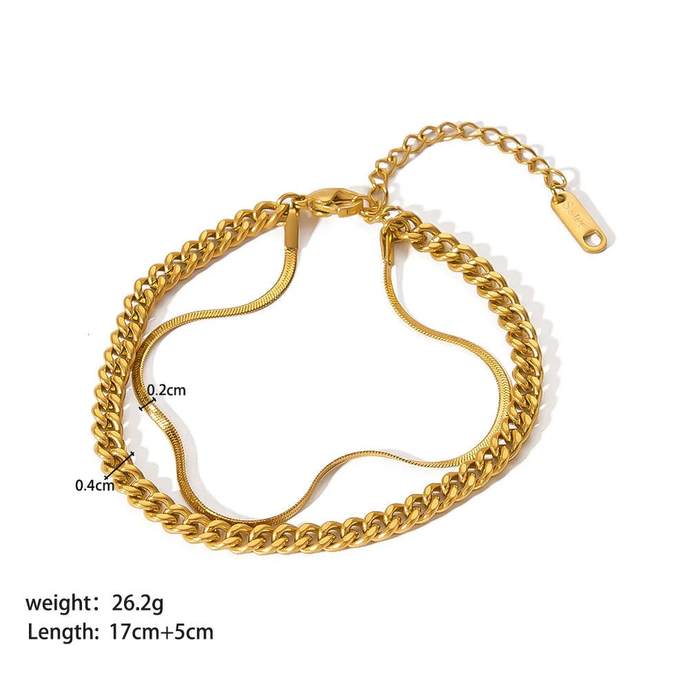 Elegant stainless steel bracelet with a sleek geometric design, gold-plated finish, and unisex style suitable for any occasion.