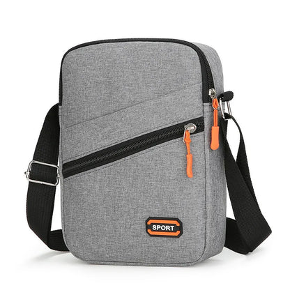 Ultra-light Oxford cloth commuter crossbody bag in solid colour with contrast stitching.