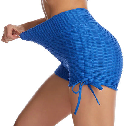 Curve-enhancing workout shorts in a variety of vibrant colors with a drawstring waistband for a customized fit.