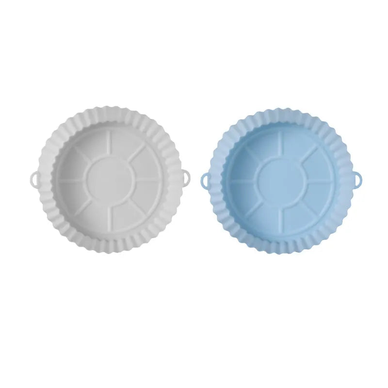 Round blue silicone baking tray mat with 4.5cm sides on a kitchen counter.