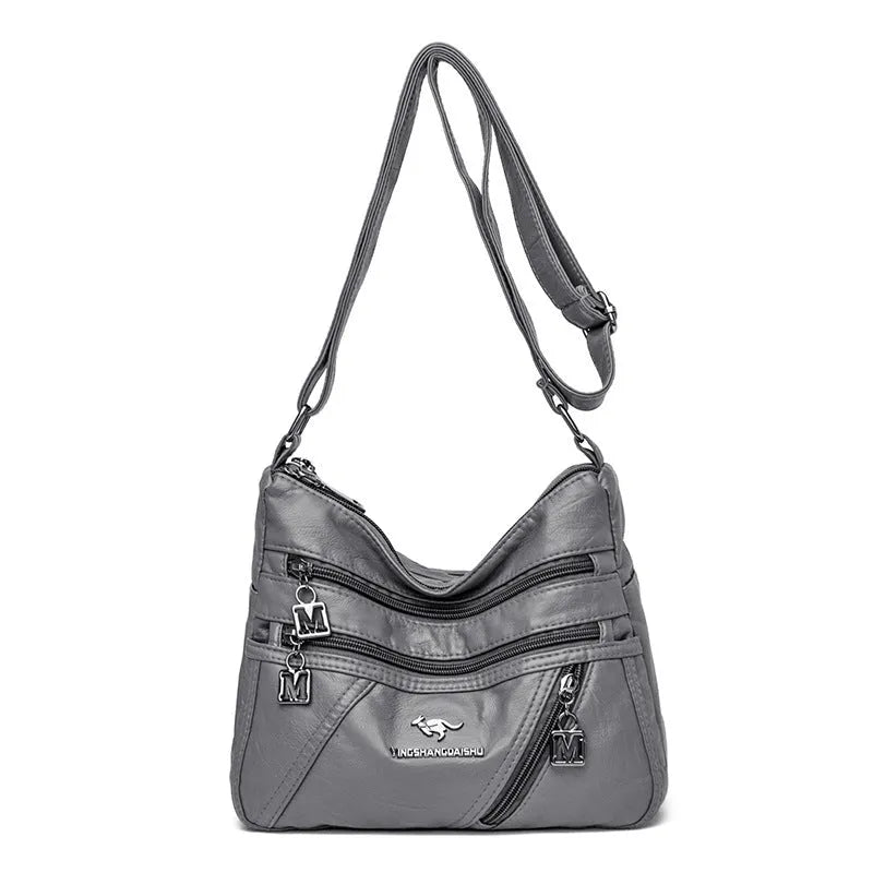 Middle-aged women's double layer PU shoulder bag with large capacity, welt pocket, and soft build in red, purple, dark blue, black, bronze, gray, or tan.
