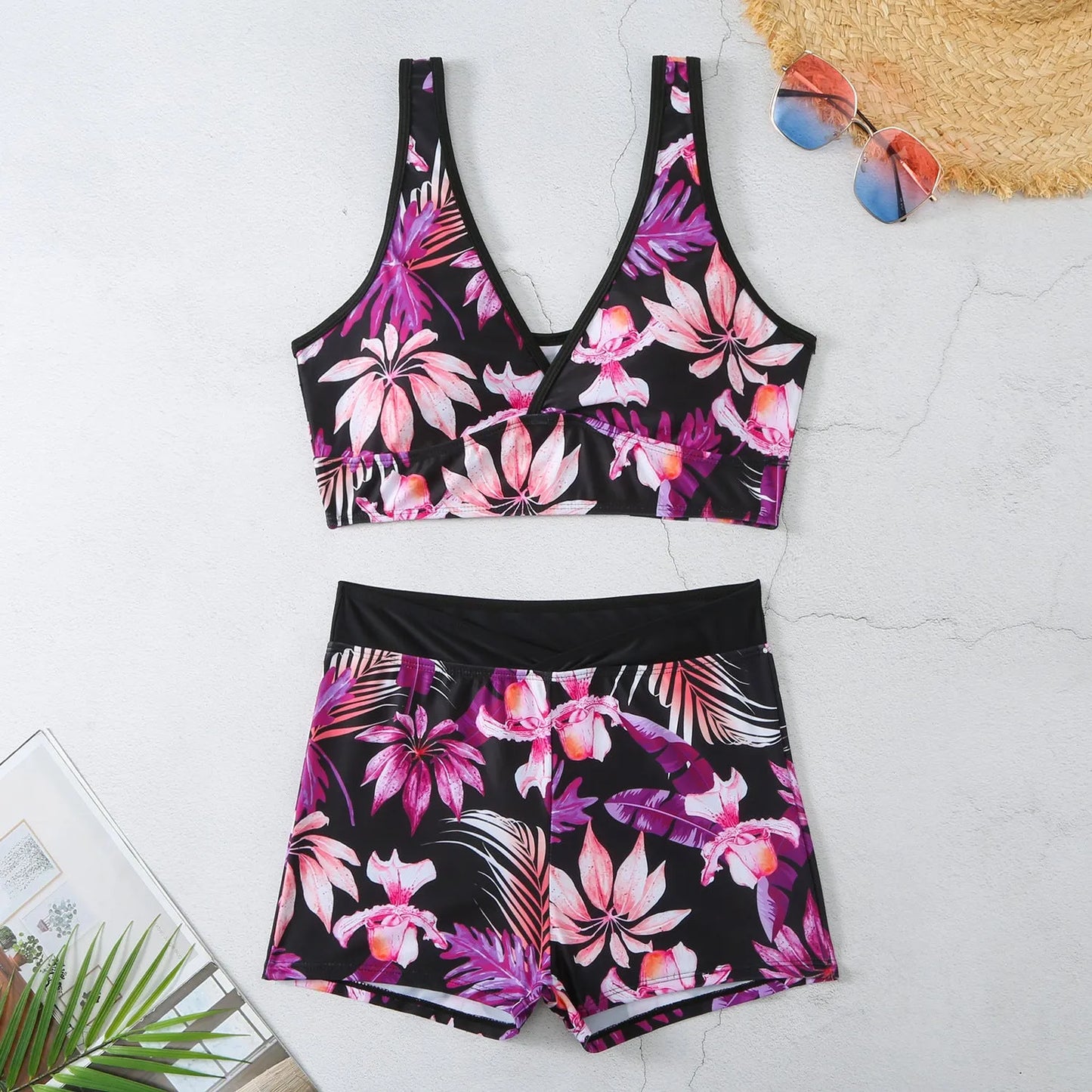 Women's two-piece swimsuit set showing sleeveless bikini top and printed boxer-style briefs in a multi-colour pattern.
