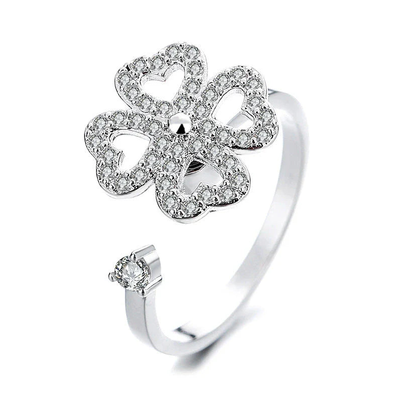 Adjustable spinner ring with rotating floral, geometric, and nature-inspired motifs for women's fashion and stress relief
