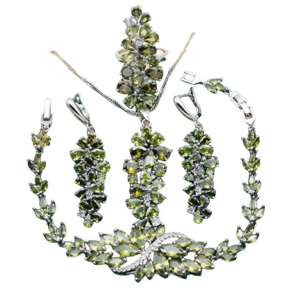 Vintage jewellery set with floral patterns showing necklace, bracelet, earrings and ring in olive green colour