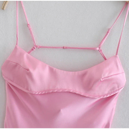 Elegant satin slip dress in pink with a square neckline, sleeveless design, and backless detail