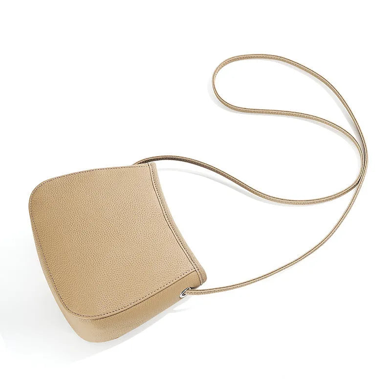 Women's genuine cowhide leather messenger bag showing organisational compartments and sandwich pockets in neutral colour