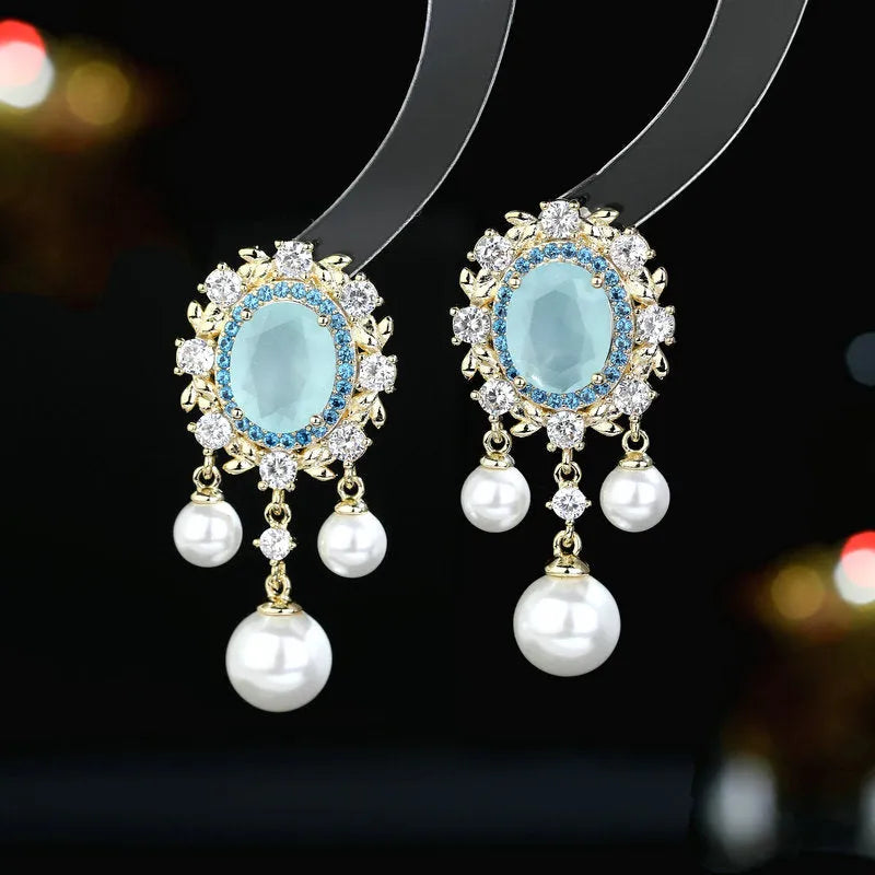 Oval geometric earrings with zircon inlaid details and pearl tassels in light purple colour