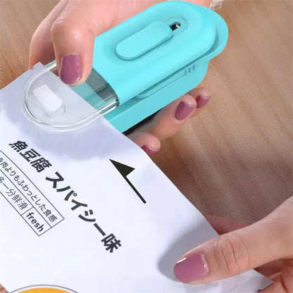 Handheld portable food bag sealer in black, white, or lake blue with sealing and cutting functions