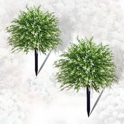 White artificial lavender plant with green leaves, a plastic floor decoration for home or events.