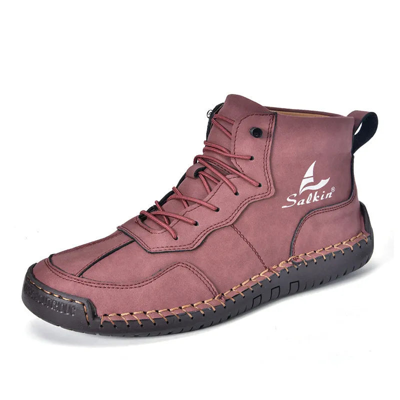 A pair of beige high-top casual boots with elastic band fastening and a flat rubber sole.