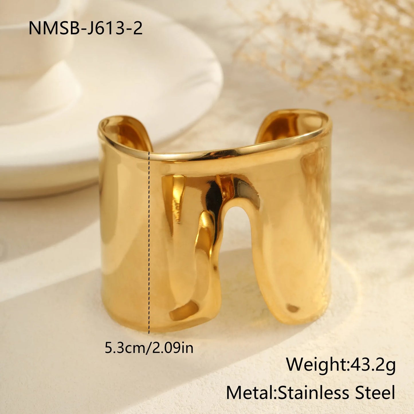 Women's stainless steel bracelet with 18K gold plating featuring exaggerated wide geometric wave design and niche opening