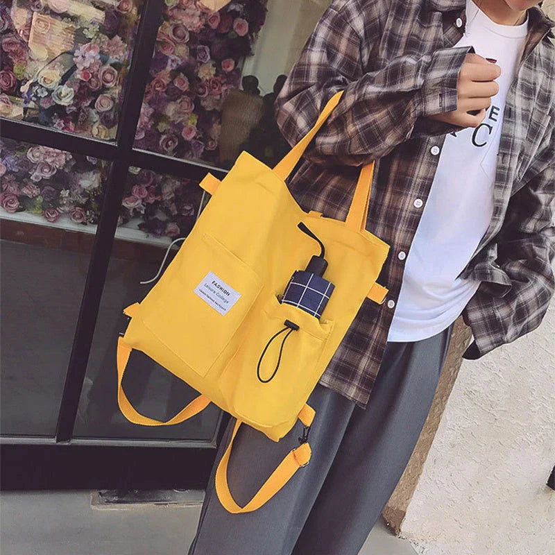 Stylish Harajuku-inspired canvas backpack with pockets, available in a variety of vibrant colors