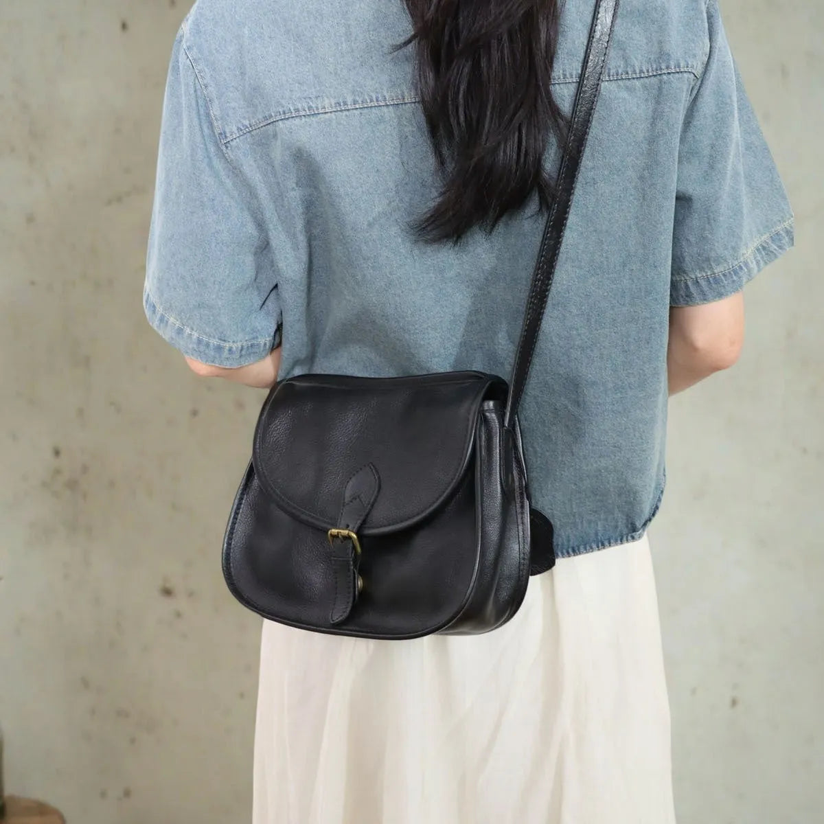 Genuine leather retro messenger bag with crossbody strap and flap closure in coffee colour