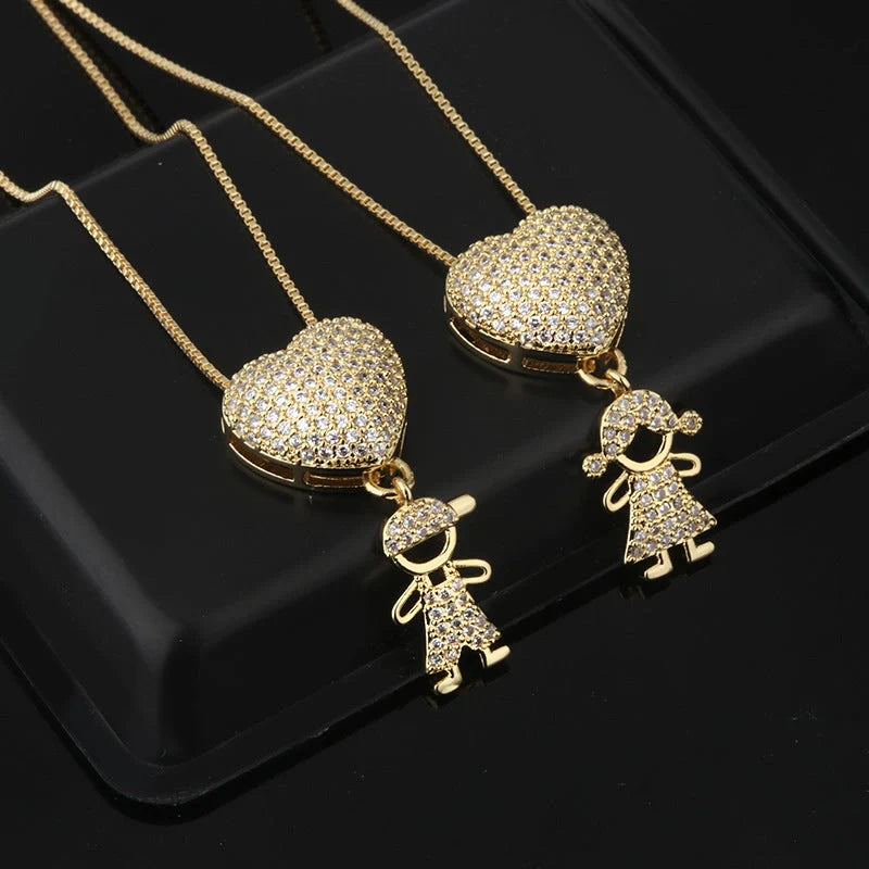 Gold cubic zirconia heart pendant necklace for mothers, symbolising family love.