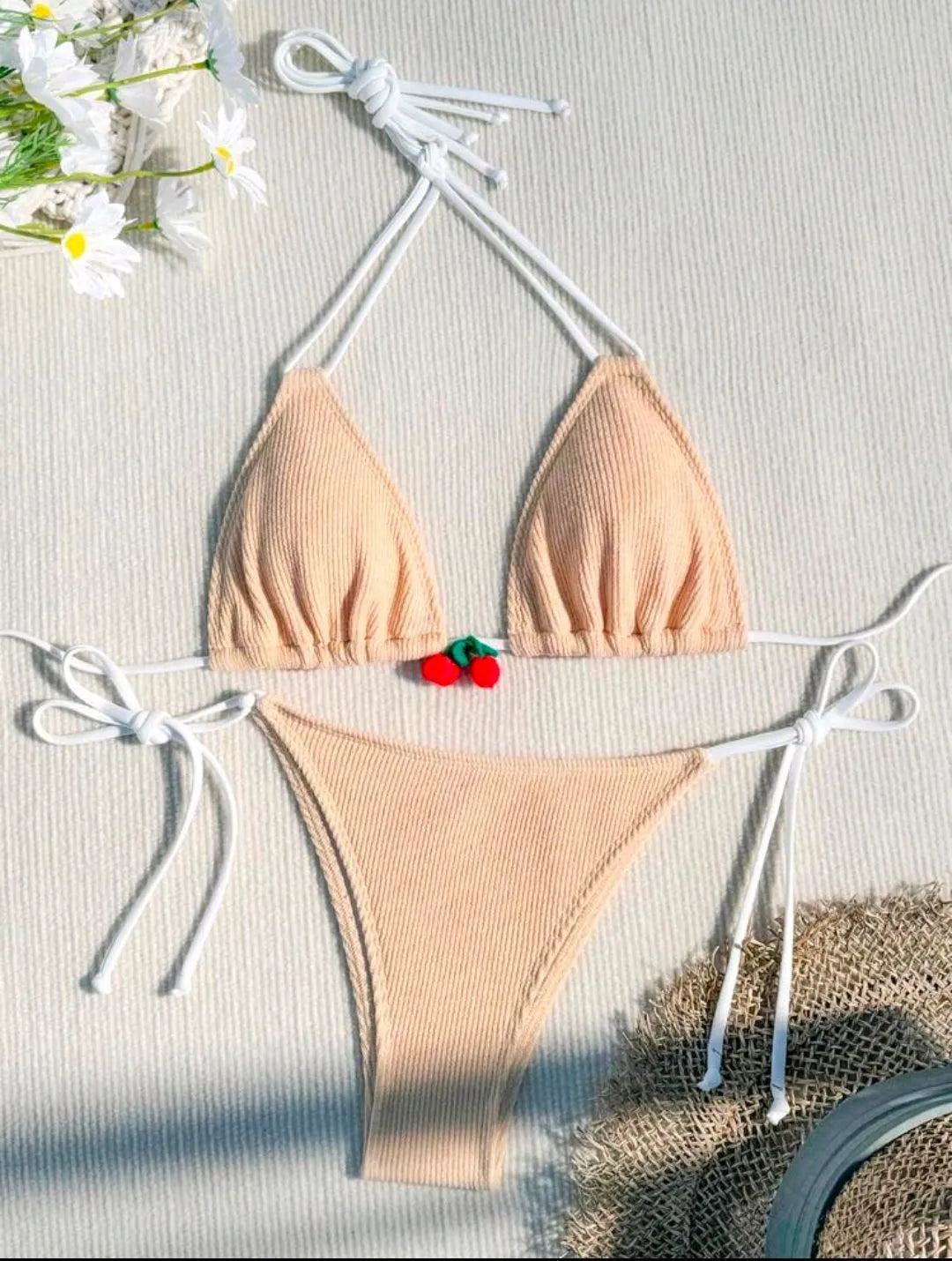 Women's sexy wind style bikini swimsuit in a solid colour, showing backless briefs design.