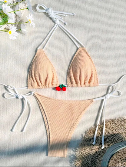Women's sexy wind style bikini swimsuit in a solid colour, showing backless briefs design.