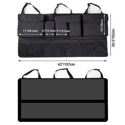 Black car hanging storage bag made of waterproof Oxford cloth with a handle, shown hanging in a vehicle boot.