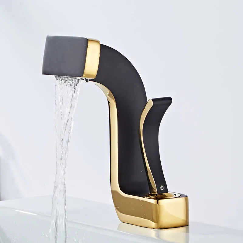 Copper vanity basin mixer tap with lift handle, shown in black and gold finish.