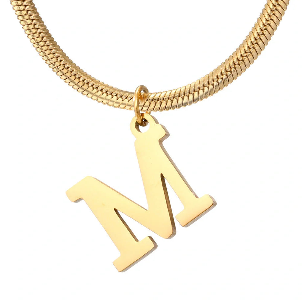 Elegant gold A-Z letter pendant necklace on a snake chain
