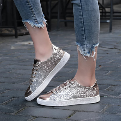 Women's low-top casual shoes with black sequin upper, round toe, and white rubber sole with lace-up closure.