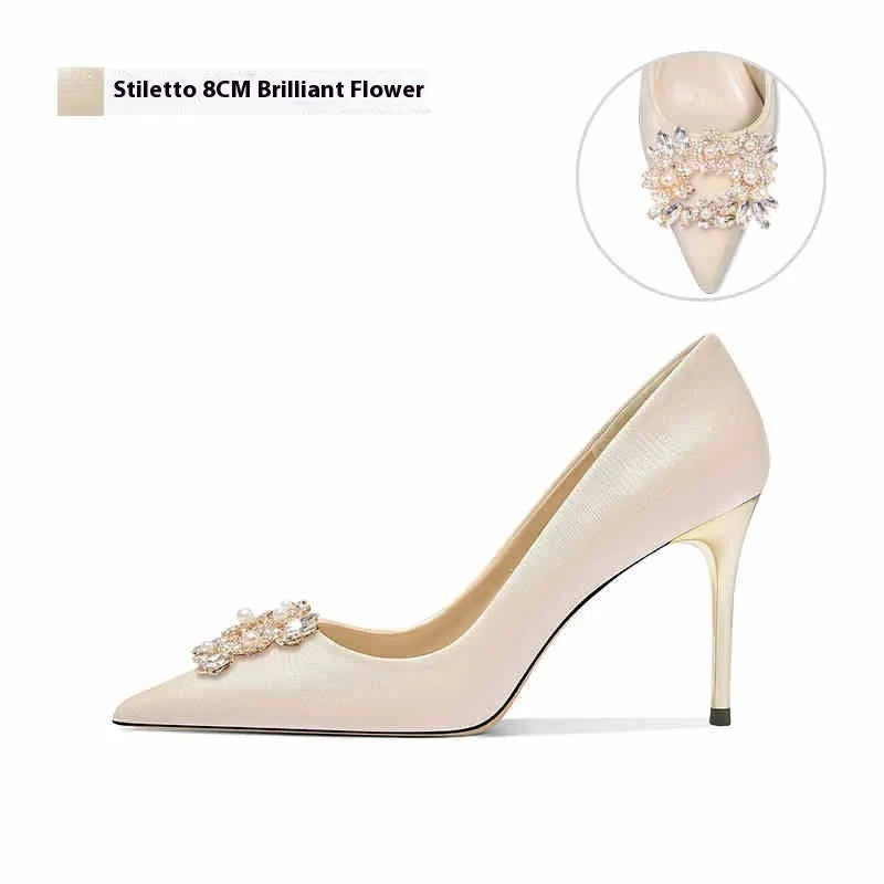French crystal bridal high heel pump with rhinestones on cloth upper, showing pointed toe and stiletto heel.