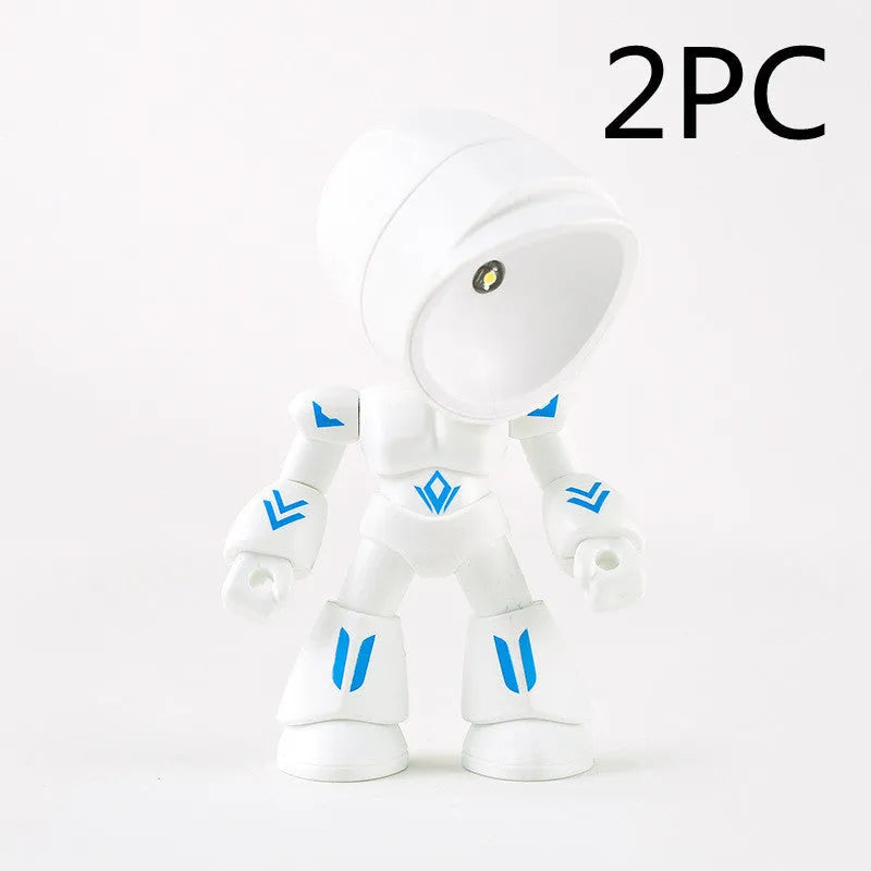 Mini mecha robot hero LED night light with adjustable arms on a desk.