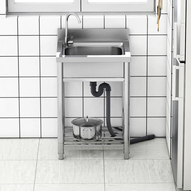 Stainless steel vegetable washing basin with a brushed finish and a deep, single sink design.