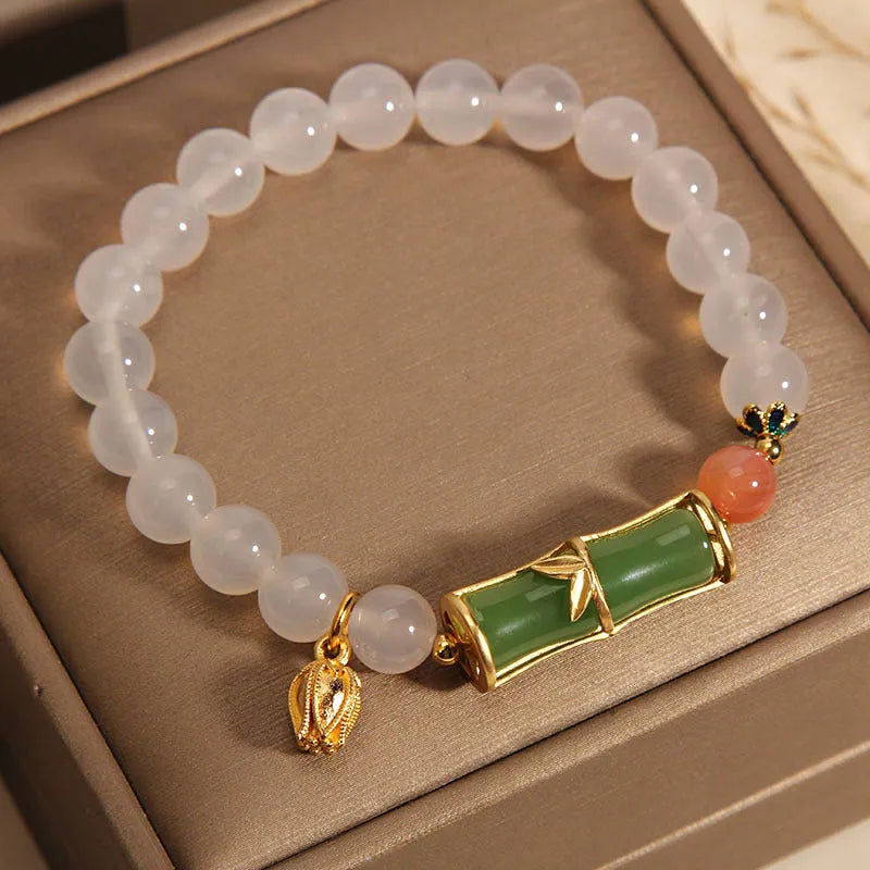 Women's white agate and jade bamboo bead bracelet in retro Chinese style.