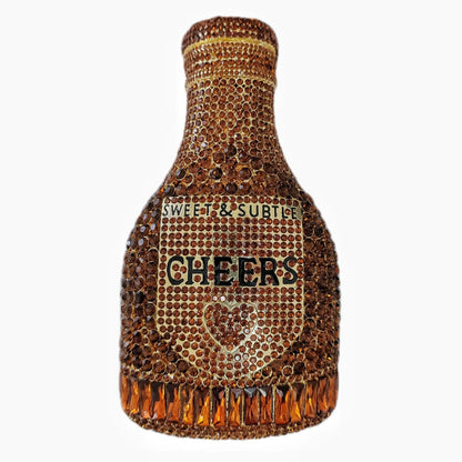Gold hard-shell clutch bag shaped like a champagne bottle with a synthetic leather interior.